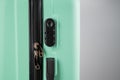 Close-up of a combination lock of a mint plastic suitcase. Royalty Free Stock Photo