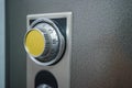 Close up of combination safe with yellow knob