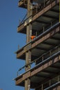 Close up of commercial office building under construction with construction workers ,steel beams with weight of steel beams sprypa Royalty Free Stock Photo