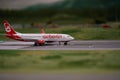 Close-up of a commercial passenger jet on an airport runway