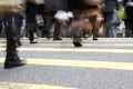 Close Up Of Commuters Feet Crossing Busy Street