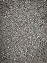 Close-up of compact gravel stones in mixed earth tones. Royalty Free Stock Photo