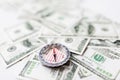 Close up of compass and dollar money Royalty Free Stock Photo