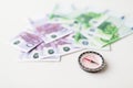 Close up of compass and euro money on table Royalty Free Stock Photo