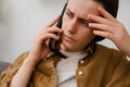 Close up of Compassionate millennial lady support friend by cell try to help ponder on advice. Sad young woman has difficult phone Royalty Free Stock Photo