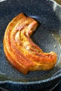 Close-up of a complete piece of delicious fried pork belly