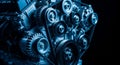 Close-up of a complex internal combustion engine with blue lighting and dark background Royalty Free Stock Photo