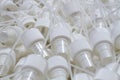 Close-up of component caps, lids, tubes for aerosol cans and sprayers of chemicals and perfumes. Parts used in the aerosol Royalty Free Stock Photo