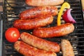 Bratwursts on a grill.