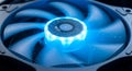 Close up of a computer cpu cooler fan with blue led lighting for optimal performance Royalty Free Stock Photo