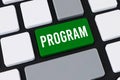 Close-up of a computer keyboard with a green key and white text that reads PROGRAM for software coding and development Royalty Free Stock Photo