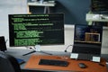Close up of Computer Monitor and Laptop Displaying Programming Code in Office Royalty Free Stock Photo