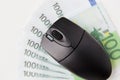 Close up of computer mouse and euro money Royalty Free Stock Photo