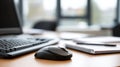 Close-up of a Computer Mouse and Keyboard on an Office Desk with Notebook and Papers in a Modern Workspace Environment Royalty Free Stock Photo