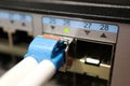 Close up of a computer network fiber optic cable connected to a switch Royalty Free Stock Photo
