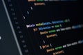close-up of computer screen with colorful sass code, focus on mixin and media queries, web development and frontend design