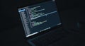 Close up of computer screen displaying lines of code in a dark environment programmer coding digital data Royalty Free Stock Photo