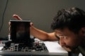 Close-up of computer technician male installing CPU cooler onto motherboard, performing maintenance and repair work on Royalty Free Stock Photo