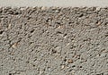 Close-up of a concrete surface showcasing exposed aggregate texture. The rough Royalty Free Stock Photo