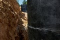 Close-up of a concrete well covered with waterproof mastic