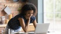 Close up confident African American woman using laptop, standing Royalty Free Stock Photo