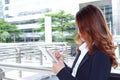 Close up confident Asian secretary woman writing on notebook about job at building site