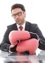 Close up.confident businessman Boxing gloves sitting at his Desk Royalty Free Stock Photo