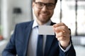 Close up confident businessman showing empty business card at camera Royalty Free Stock Photo