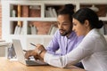 Close up confident Indian businesswoman mentor teaching African American intern Royalty Free Stock Photo