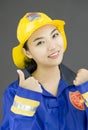 Close up of a confident lady firefighter showing thumbs up sign