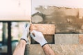 close up of construction builder working with stone and paving