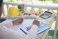 close up construction engineer man hands working at office desk architect workplace. Engineer Men hands drawing holding folder, Royalty Free Stock Photo