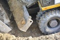 Close-up of construction equipment. Soil extraction by excavator. Improvement and construction, road works. Works on landscaping Royalty Free Stock Photo