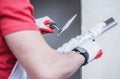 Construction Worker Applying Drywall Compound On Taping Knife