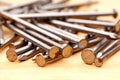 Close-up of construction nails on wood Royalty Free Stock Photo