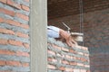 Close-up of construction process mason work with brick installation Royalty Free Stock Photo