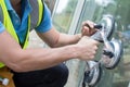 Close Up Of Construction Worker Preparing To Fit New Windows