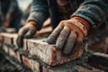 Close-up of construction worker's hands laying bricks, creating a sturdy wall Royalty Free Stock Photo