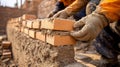 Close-up of a Construction Worker\'s Hands Laying Bricks in Mortar Royalty Free Stock Photo