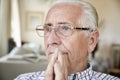 Close up of contemplative senior man at home Royalty Free Stock Photo