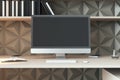 Close up of contemporary home office interior with workplace, decorative designer wall, mock up computer monitor and furniture. 3D