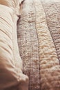 Close up of contemporary luxury bed quilt cover and pillows Royalty Free Stock Photo