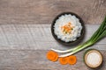 Close up of cooked rice in wooden in bowl on wooden table Royalty Free Stock Photo