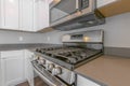 Close up of the cooktop and oven of a range inside a modern kitchen Royalty Free Stock Photo