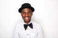 Close up cool african american man smiling with bowtie and hat Royalty Free Stock Photo