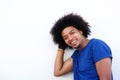 Close up of a cool guy with afro smiling