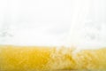 Close up of cool lager beer splash  on white background with realistic bubbles Royalty Free Stock Photo