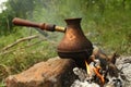 A copper pot with coffee Royalty Free Stock Photo