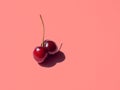 Double cherry on pink bright background Royalty Free Stock Photo