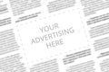 Close up of a copy space with wrtitten words Your Advertising Here on a blurred background of a newspaper. Business Royalty Free Stock Photo